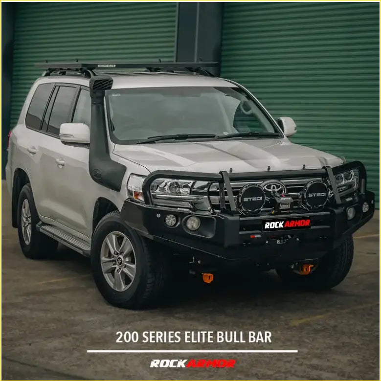 Black rockarmor elite bull bar made of steel mounted on a white toyota land cruiser 200 series