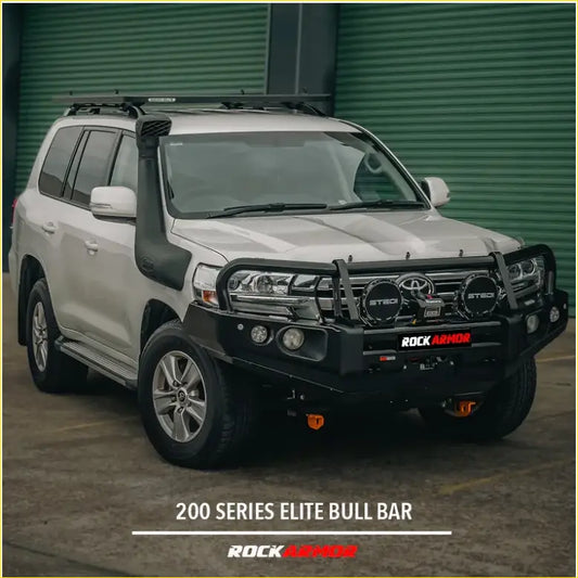 Black rockarmor elite bull bar made of steel mounted on a white toyota land cruiser 200 series