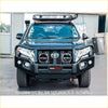 Black rockarmor elite hoop steel bullbar combo in black fitted to toyota prado fj150 with round headlights and roof rack for offroad 4wd