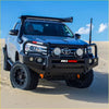 Black rockarmor elite hoop steel bullbar with round lights and orange tow hooks on silver toyota hilux ute 4wd offroad