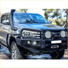 Black steel rockarmor elite hoop bullbar with auxiliary lights and winch mount fitted on dark gray toyota hilux ute 4wd offroad