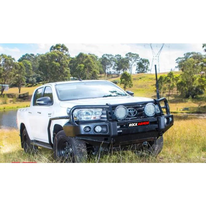 White Toyota pickup truck with black elite bull bar and fog lights for Hilux N80 2015-2020