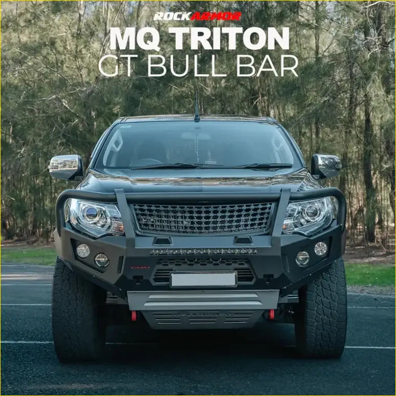 Black rockarmor mq triton gt black steel bull bar mounted on a pickup truck for tough off-road protection