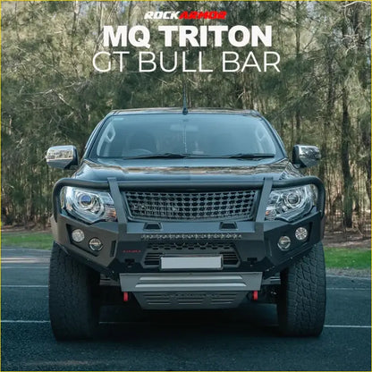 Black rockarmor mq triton gt black steel bull bar mounted on a pickup truck for tough off-road protection