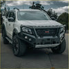White nissan navara ute with black offroad rockarmor gt hoop bullbar combo pack and rugged 4wd tires