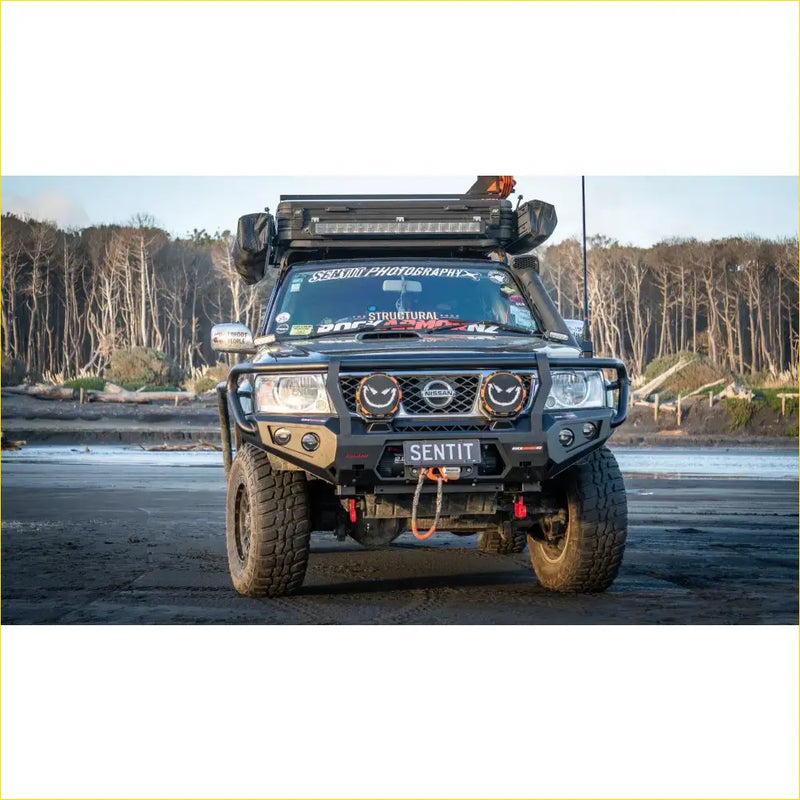 Black nissan patrol with rockarmor gt hoop bullbar combo roof rack and rugged offroad 4wd features