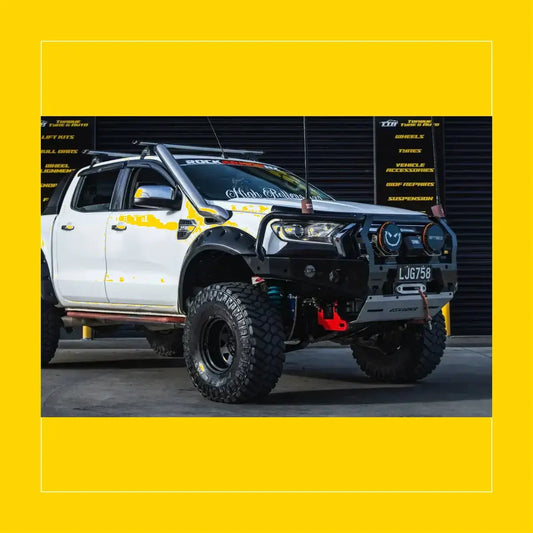 White ford ranger wildtrak with black steel rockarmor gt hoop bullbar full bar replacement and yellow decals