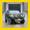 Black isuzu d-max with rugged steel rockarmor gt hoop bullbar off-road tires and roof rack 2017-2020 model