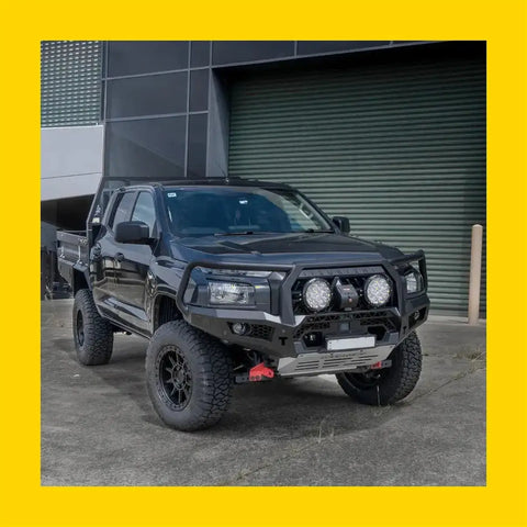 Black steel rockarmor gt hoop bullbar with three off-road lights on lifted isuzu mux 2020-2024 front end