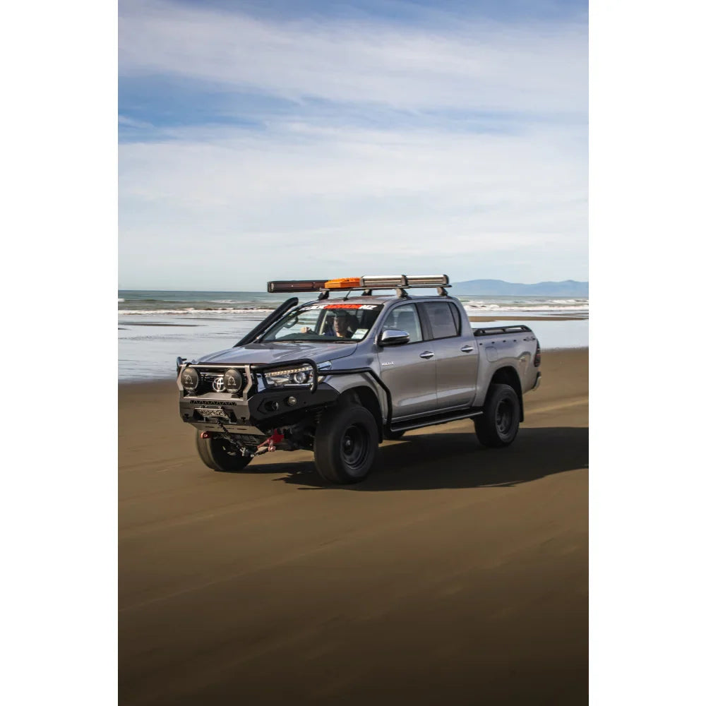 Silver off-road pickup truck with Rockarmor GT Hoop Steel Bullbar on Toyota Hilux N80