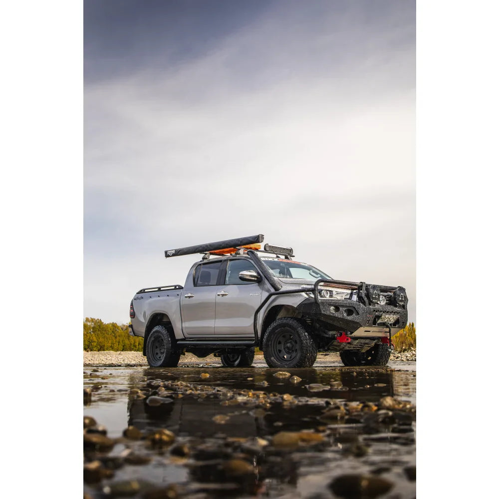 Silver off-road pickup truck with Rockarmor GT Hoop Steel Bullbar on Toyota Hilux N80