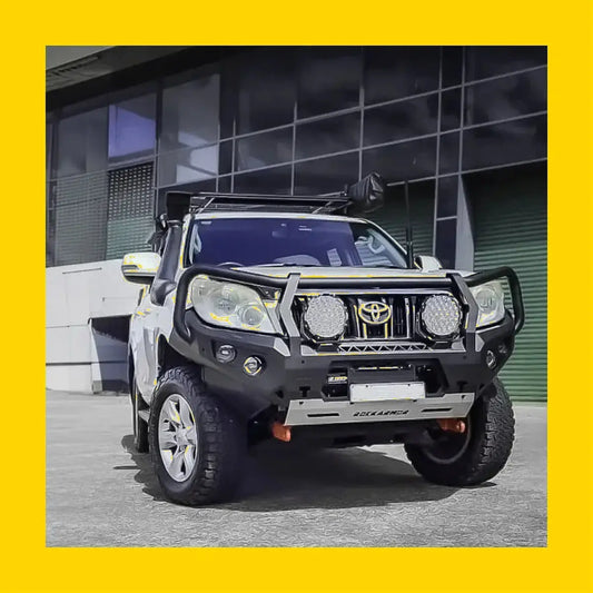 Rockarmor gt hoop steel bullbar front bumper in black and silver steel with integrated circular lights on toyota prado 150