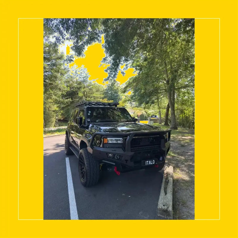 Black matte rockarmor gt hoop steel bullbar on off-road toyota prado 250 with rugged bumper and roof rack