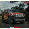 Orange isuzu dmax pickup with black rockarmor gt hoopless bullbar and dual circular led lights frontal combo pack