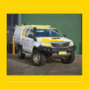 White toyota hilux with yellow accents featuring rockarmor gt hoopless steel bullbar for rugged off-road use