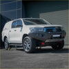 White toyota hilux 4wd ute with rockarmor gt hoopless steel bullbar and black front bumper guard for offroad use