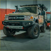 Tan toyota landcruiser 76 78 79 with black steel rockarmor gt hoopless bullbar and rugged offroad 4wd tires