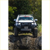 White mazda ute with black steel offroad roof rack and rockarmor gt steel hoop bullbar combo pack for 4wd use
