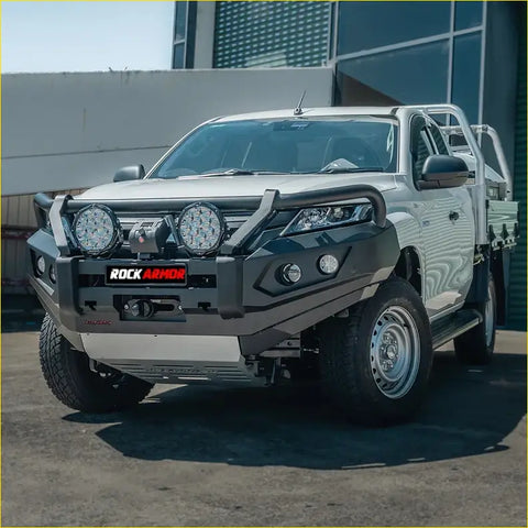 Silver mitsubishi mr triton ute with black steel rockarmor gt steel hoop bullbar and led lights for offroad 4wd use