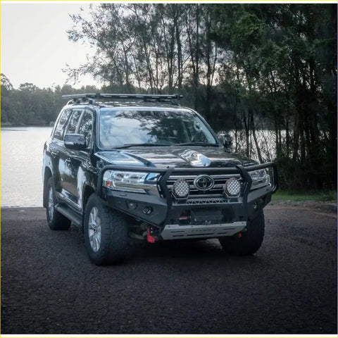 Black toyota land cruiser with rugged steel rockarmor gt hoop bullbar combo pack and roof rack for offroad 4wd use