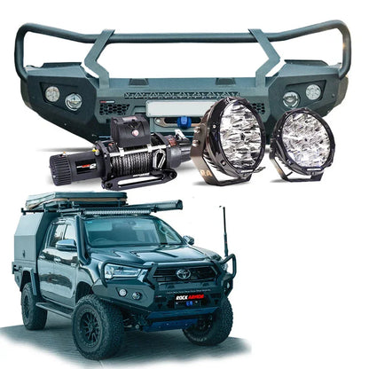Off-road vehicle accessories featuring a steel hoop bull bar and driving lights for Toyota Hilux 2020+