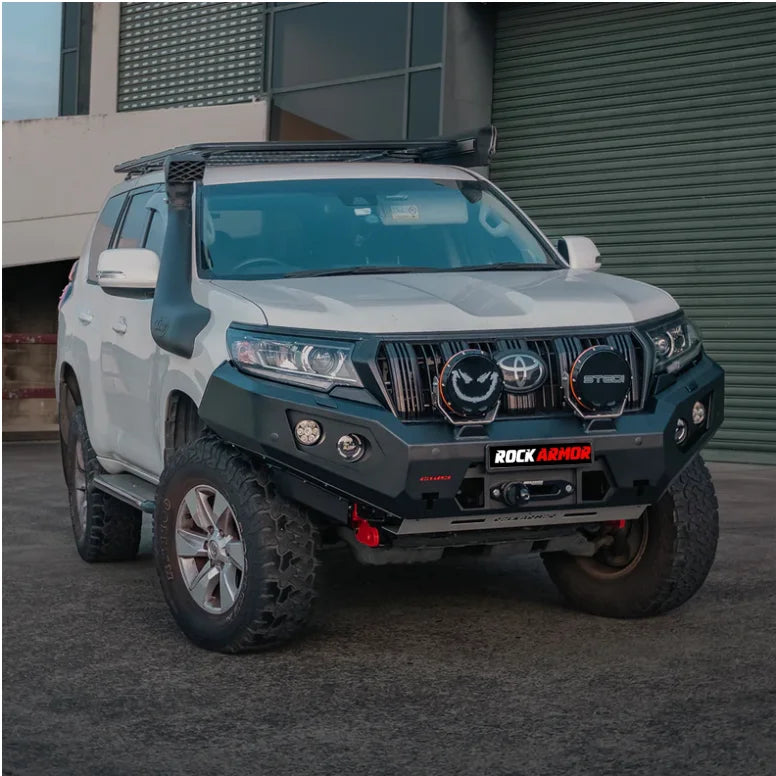 White SUV with aftermarket bull bar, driving lights, and Rockarmor GT Steel snorkel