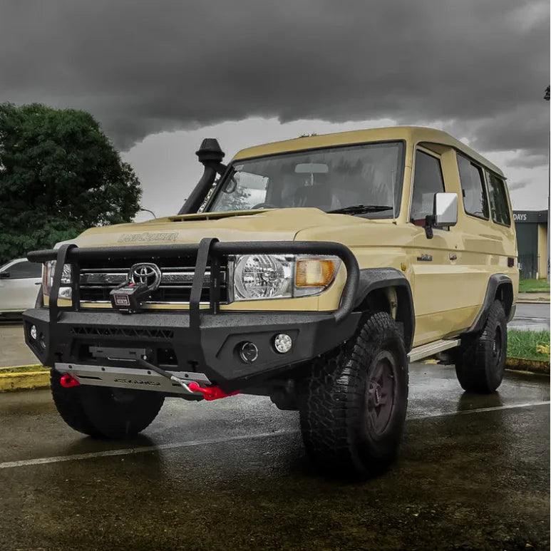 Beige Toyota Land Cruiser with aftermarket steel hoop bullbar and bumper for VDJ78 Troopy