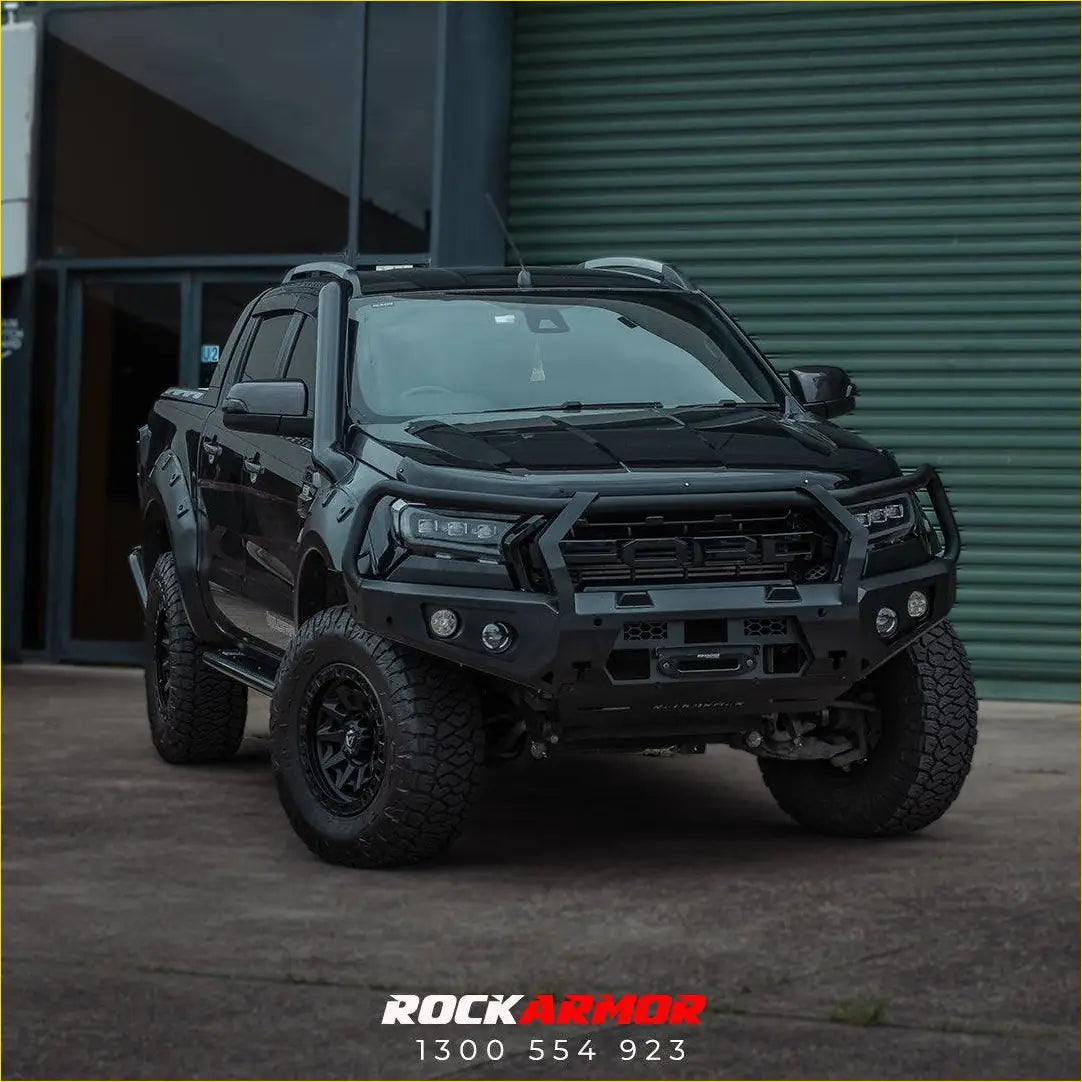 Black ford ranger with rockarmor gt steel hoop bullbar heavy-duty front bumper and rugged off-road tires