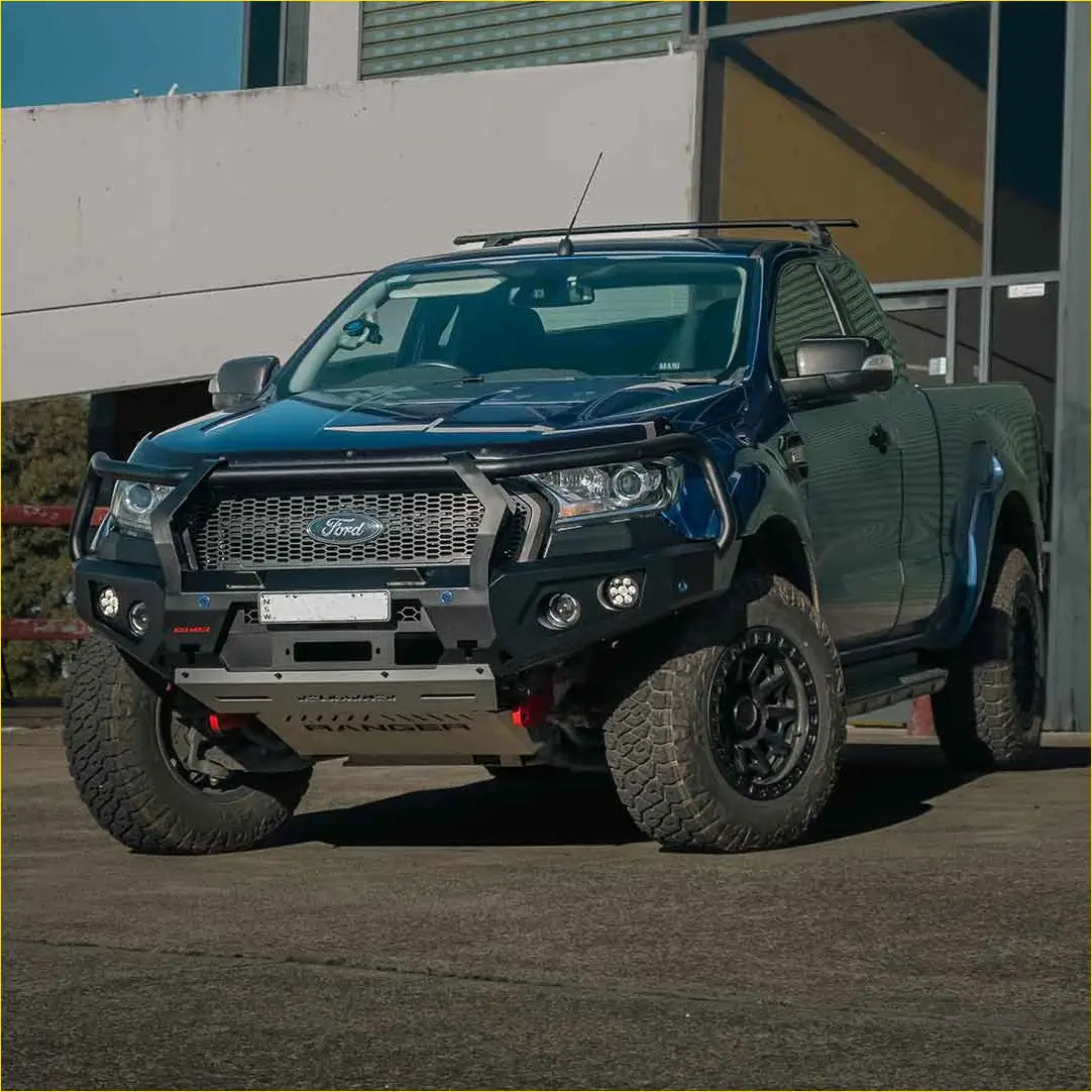 Dark blue ford ranger with black rockarmor gt steel hoop bullbar and rugged off-road tires