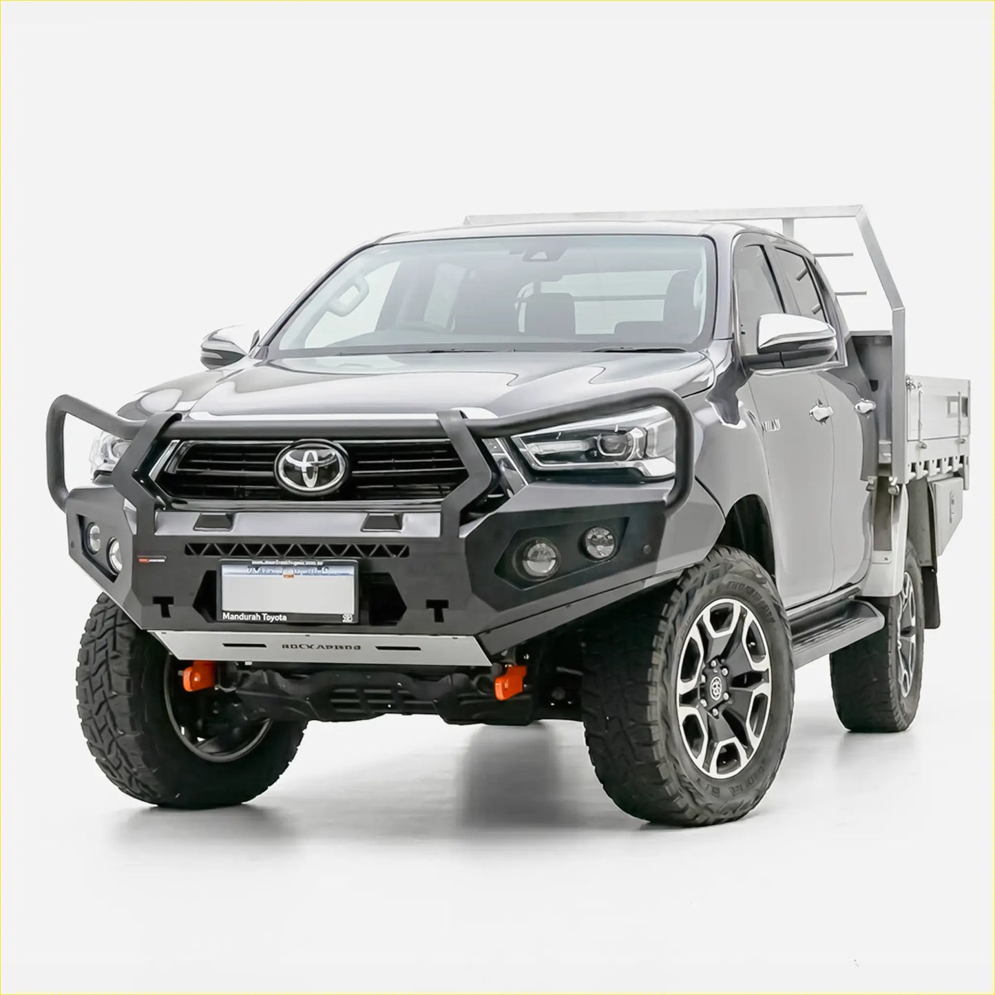 Gray toyota hilux with black and silver rockarmor gt steel hoop bullbar rugged off-road tires and alloy wheels