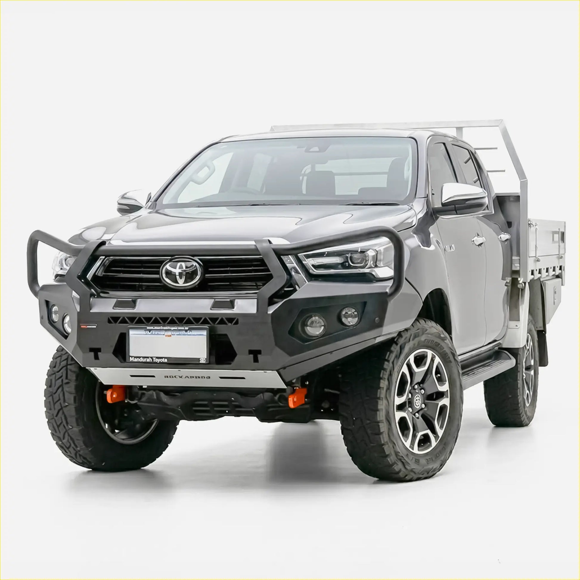 Gray toyota hilux with black and silver rockarmor gt steel hoop bullbar rugged off-road tires and alloy wheels