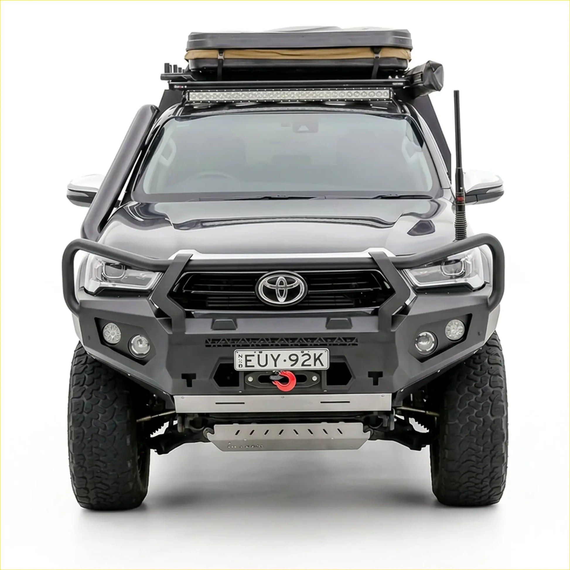 Black Toyota Hilux 2020-2025 with Rockarmor GT steel hoop bullbar and rugged off-road roof rack visible from the back