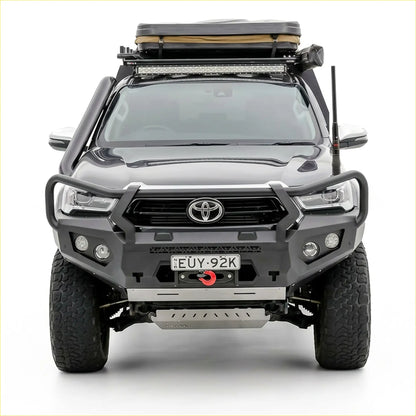 Black Toyota Hilux 2020-2025 with Rockarmor GT steel hoop bullbar and rugged off-road roof rack visible from the back