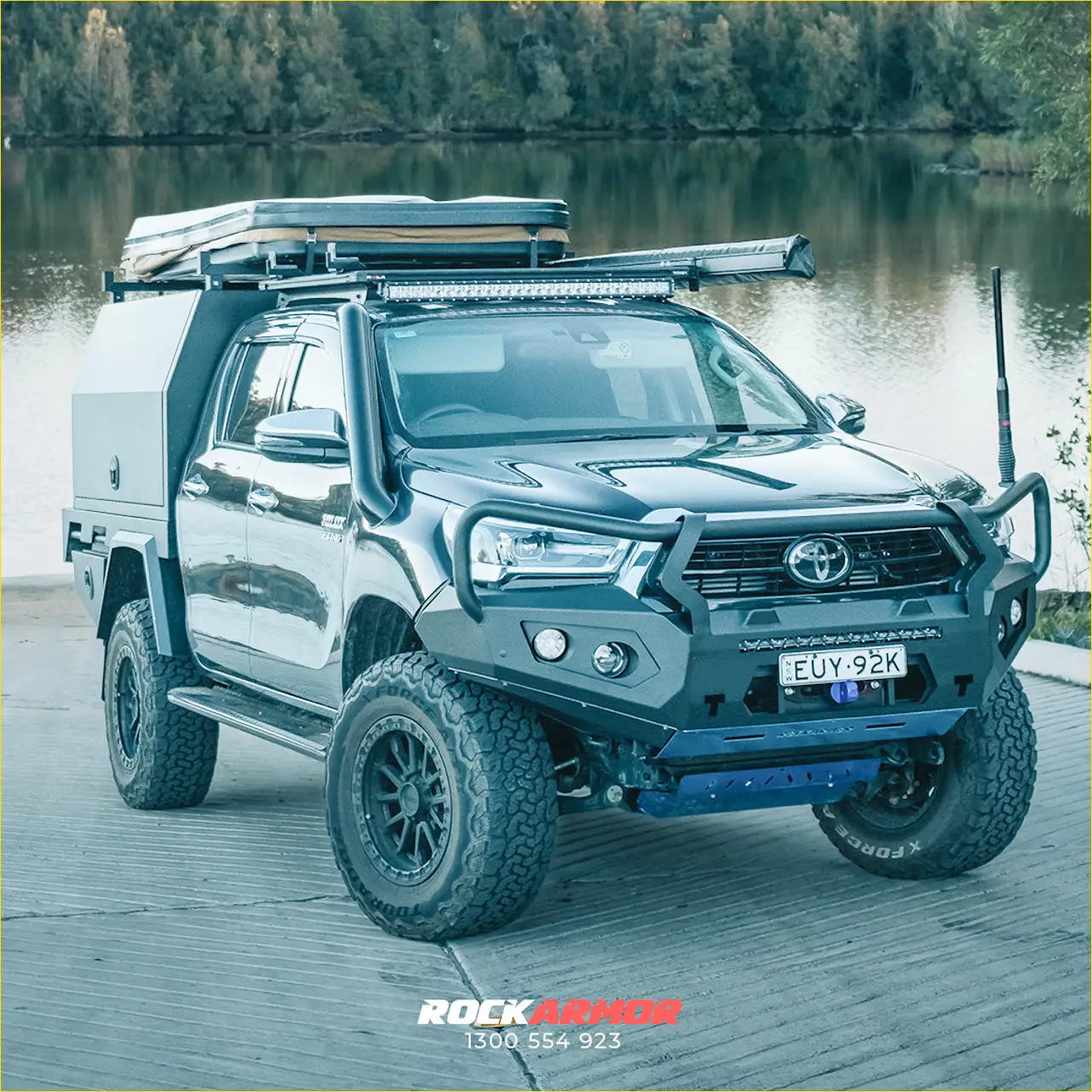 Black toyota sr hilux 2020-2025 with rockarmor gt steel hoop bullbar and rugged off-road roof rack setup