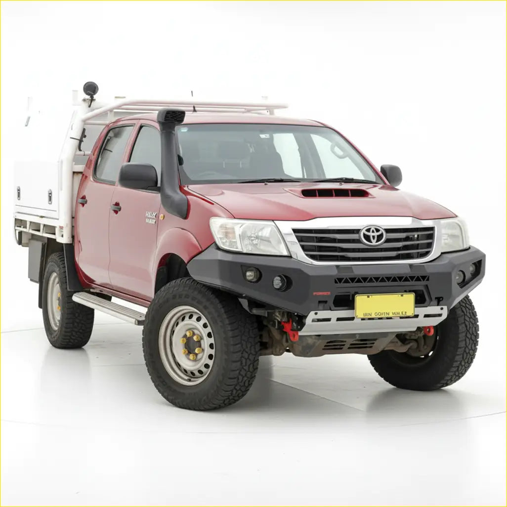 Red toyota hilux with white utility bed featuring rugged rockarmor gt steel hoop bullbar for 2007-15 models