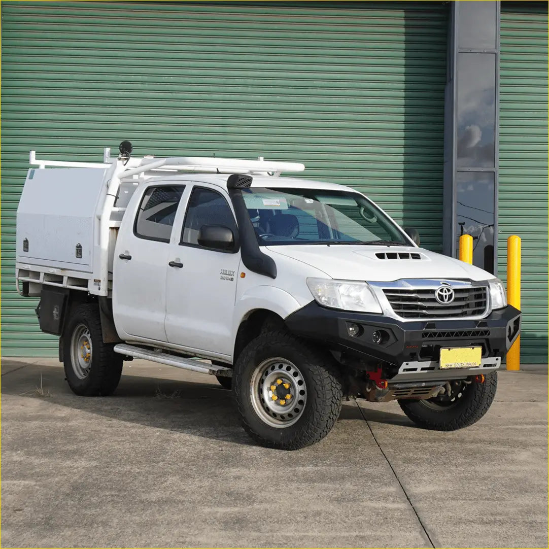 White toyota hilux with custom white cargo box and black rockarmor gt steel hoop bullbar steel bullbar