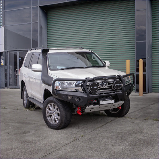 White toyota land cruiser 2018 with black steel rockarmor gt hoop bullbar roof rack and snorkel visible from front