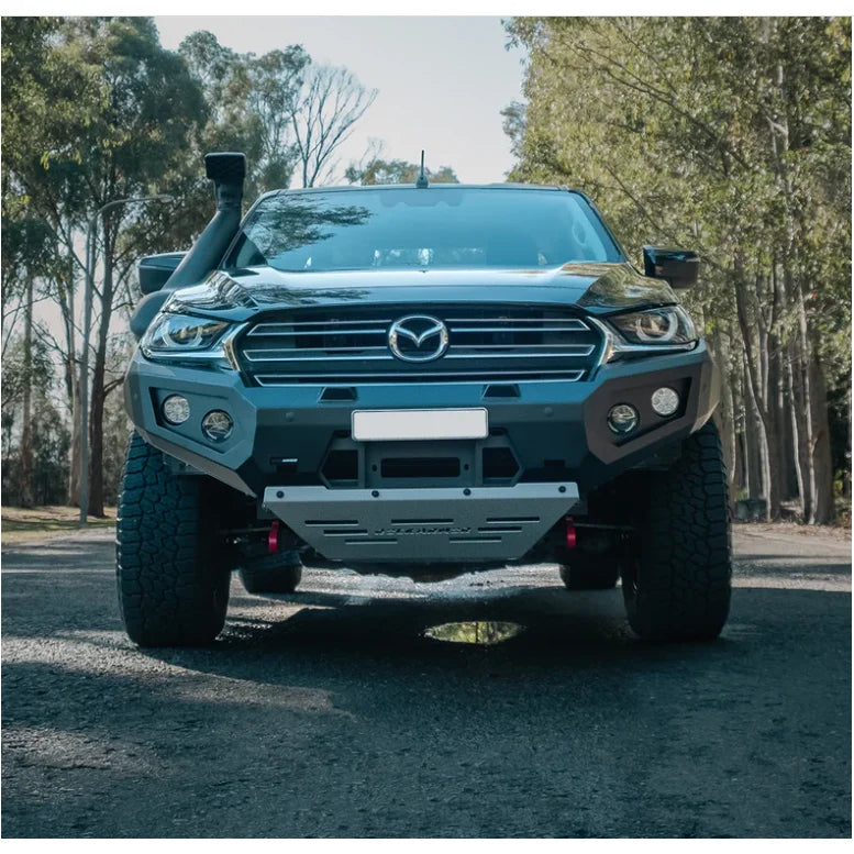 Black Mazda pickup truck with Rockarmor GT Steel bull bar and driving lights
