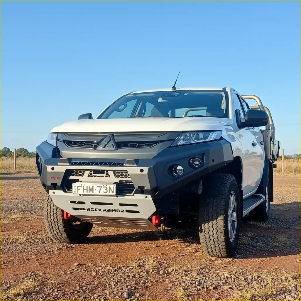 White mitsubishi triton mr pickup with black and silver rockarmor gt steel hoopless bullbar front bumper guard