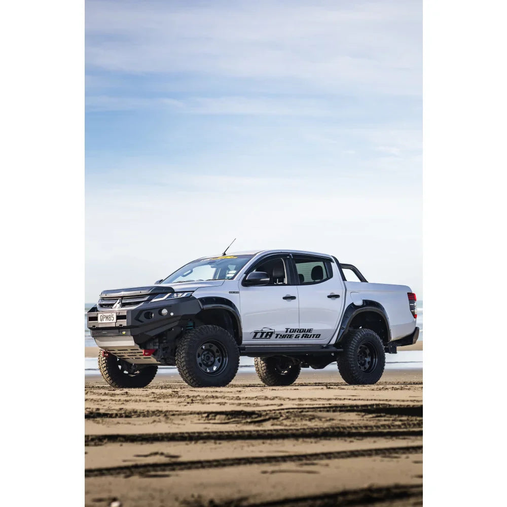 White off-road pickup truck with RockArmor GT Steel Hoopless Bullbar and driving lights