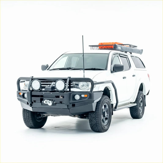 White mitsubishi triton with a black rockarmor premium steel bullbar front bumper guard and roof rack