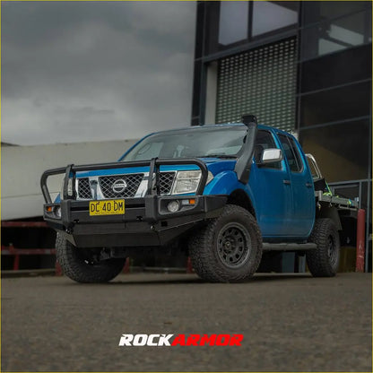 Blue nissan navara d40 pickup with rockarmor premium steel bullbar black bumper and roof-mounted snorkel