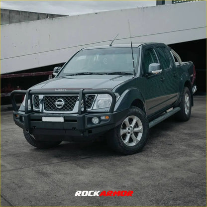 Dark green nissan navara d40 with rockarmor premium steel bullbar black front bumper guard silver alloy wheels