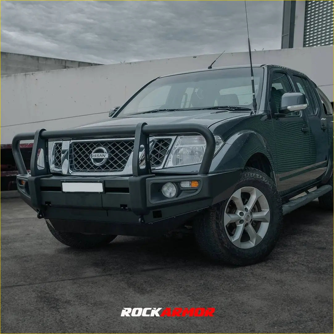 Black rockarmor premium steel bullbar front bumper guard on a nissan navara d40 2005-2015 pickup truck