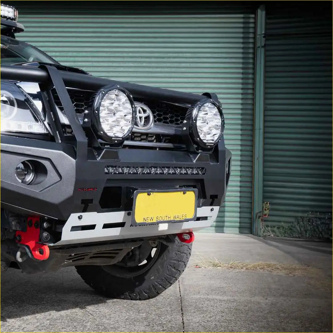 Rockarmor premium steel bullbar for Toyota Hilux N70 2005-2011 in black with rugged front bumper led lights and red tow hooks