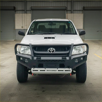 White toyota hilux n70 2005-2011 with a black rokarmor premium steel bullbar front bumper guard and grille