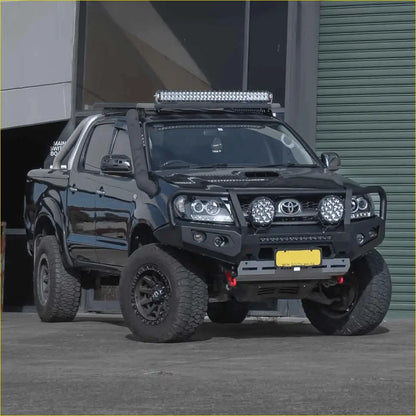 Black Toyota Hilux with rockarmor premium steel bullbar rugged off-road roof LED light bar and aggressive bumper