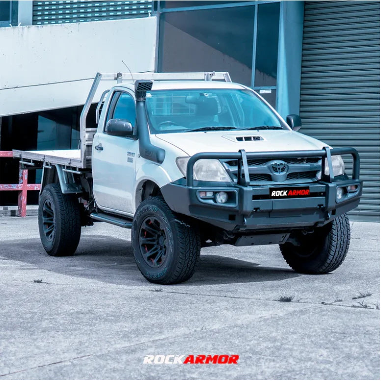 White pickup truck with black accessories featuring Rockarmor premium steel bullbar for Toyota Hilux N70