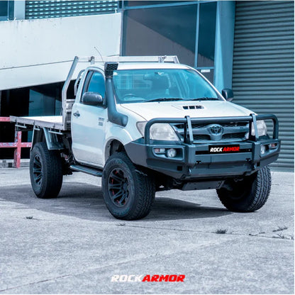 White pickup truck with black accessories featuring Rockarmor premium steel bullbar for Toyota Hilux N70