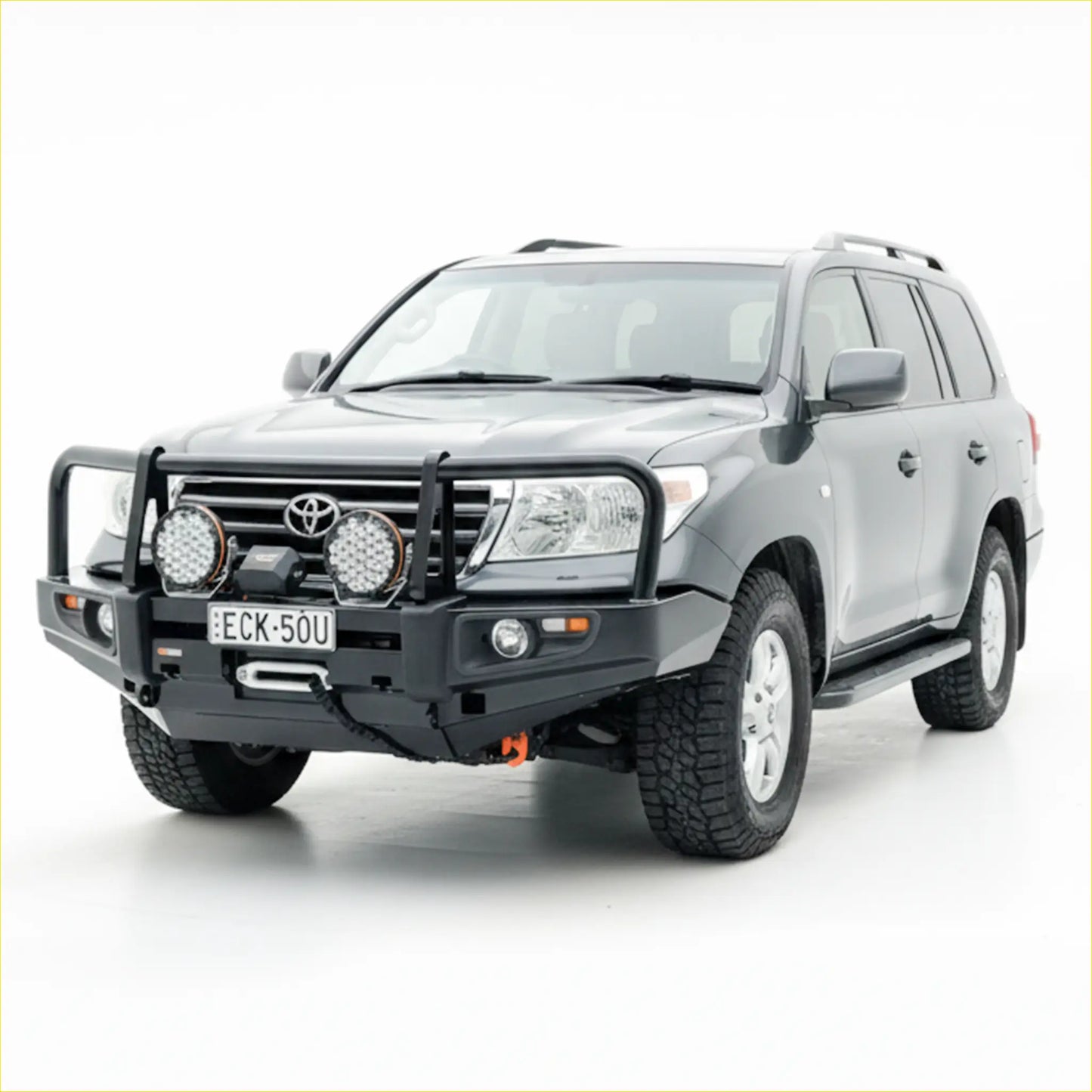 Black rugged steel rockarmor front bumper with led lights and winch mount fitted to silver toyota landcruiser 200 gx/gxl
